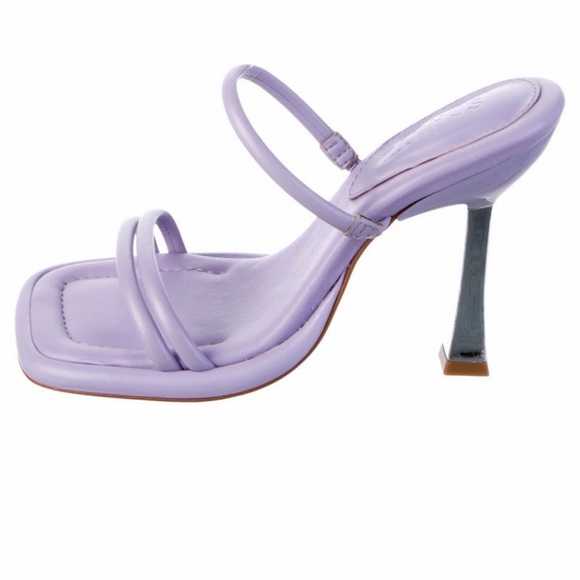 mule crafted from leather and set on a kitten heel for luxe versatility.